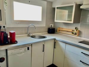 Kuchyň nebo kuchyňský kout v ubytování Apartamento playa