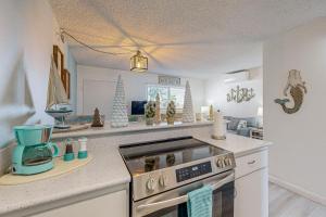 a kitchen with a stove and some christmas decorations at The Tropical Cove 329 in Marathon