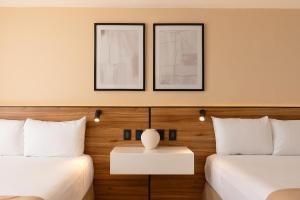 Postel nebo postele na pokoji v ubytování Hotel Calypso Cancun