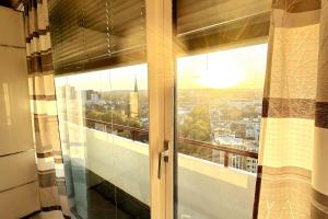 a window with a view of a city at 2 Zimmer Wohnung für 2 in Mülheim an der Ruhr