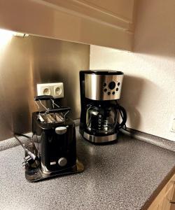 a coffee maker sitting on top of a kitchen counter at 2 Zimmer Wohnung für 2 in Mülheim an der Ruhr