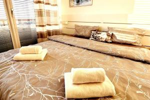 a large bed with two pillows on top of it at 2 Zimmer Wohnung für 2 in Mülheim an der Ruhr