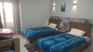 Voodi või voodid majutusasutuse فندق هابى دريمز toas