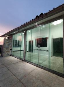 an empty building with glass windows on the side at Apartamento - Ed Sacy - COP 30 in Belém