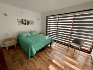 Ένα ή περισσότερα κρεβάτια σε δωμάτιο στο Gran Refugio Familiar en Pucón