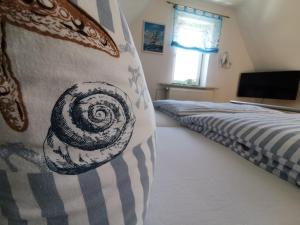 Postel nebo postele na pokoji v ubytování Gästehaus Arkona