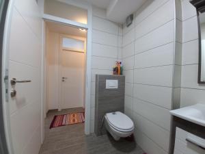 a bathroom with a toilet and a sink at Apartment Ema with garage in Velika Kladuša +30 photos