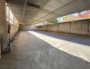 an empty hallway of a building with a roof at Hotel Dali in San Rafael