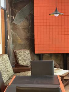 a dining room with chairs and a table with a laptop at Hotel Dali in San Rafael