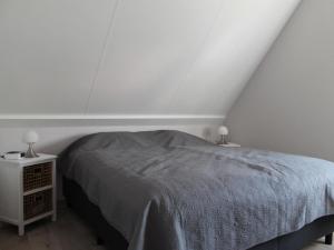 Ένα ή περισσότερα κρεβάτια σε δωμάτιο στο Holiday Home in Zeeland with Garden