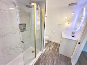 a bathroom with a shower and a sink at Home away from home in Dover +6 photos