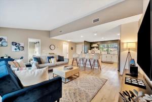 a living room with a couch and a table at Heated Pool 3b&2b home in Largo +16 photos