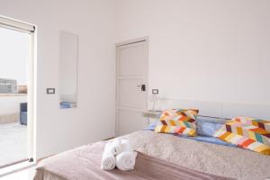 Postel nebo postele na pokoji v ubytování Dal Commediante Apartment and Room