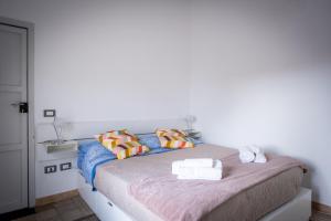 Postel nebo postele na pokoji v ubytování Dal Commediante Apartment and Room