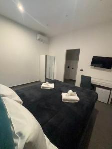 Postel nebo postele na pokoji v ubytování Doria Suites Napoli