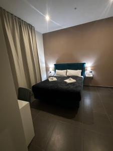 Postel nebo postele na pokoji v ubytování Doria Suites Napoli