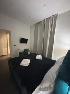 Postel nebo postele na pokoji v ubytování Doria Suites Napoli