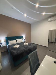 Postel nebo postele na pokoji v ubytování Doria Suites Napoli