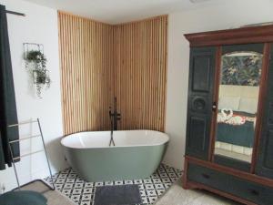 a bathroom with a large tub in a room at 8 Guests Large cottage Hotub in Hornsea +8 photos