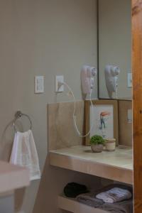 a bathroom with a sink and a mirror at Blend Lodges in Tunuyán
