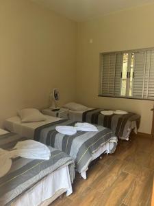 Cama ou camas em um quarto em Pousada Portal da Lua