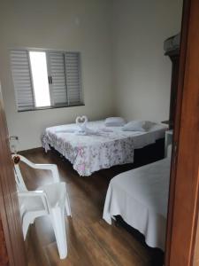 Cama ou camas em um quarto em Pousada Portal da Lua