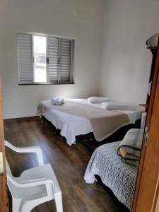 Cama ou camas em um quarto em Pousada Portal da Lua