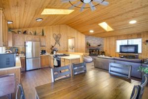 a large kitchen with wooden walls and a ceiling at The Drowsy Den With Firepit & BBQ Plus Large Patio in Big Bear Lake