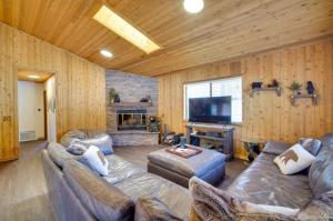 a living room with two couches and a television at The Drowsy Den With Firepit & BBQ Plus Large Patio in Big Bear Lake