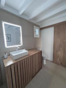 a bathroom with a sink and a toilet at Lakay zot in Le Vauclin +10 photos