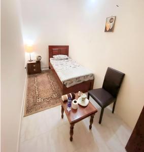 Postel nebo postele na pokoji v ubytování Abu Dhabi Comfortable