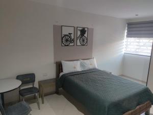 Letto o letti in una camera di Hotel Ocean Fusagasuga