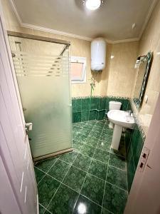 a bathroom with a shower and a sink and a toilet at First row villa on the sea in the village of Aquarius family only in Ain Sokhna