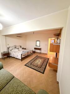 a large bedroom with a bed and a rug at First row villa on the sea in the village of Aquarius family only in Ain Sokhna
