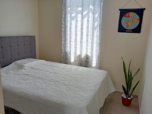 En eller flere senge i et værelse på Alojamiento Casa en Ica + 3 billeder