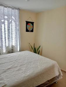 En eller flere senge i et værelse på Alojamiento Casa en Ica