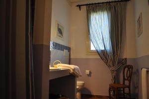 A bed or beds in a room at Podere L'Olmaia