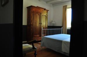 A bed or beds in a room at Podere L'Olmaia