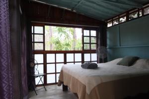 Postel nebo postele na pokoji v ubytování PachaMama Bio