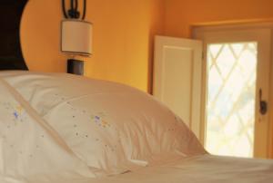 A bed or beds in a room at Podere L'Olmaia