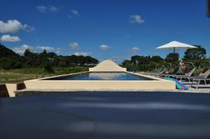 The swimming pool at or close to Podere L'Olmaia