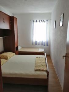 Postel nebo postele na pokoji v ubytování Apartment Slaven