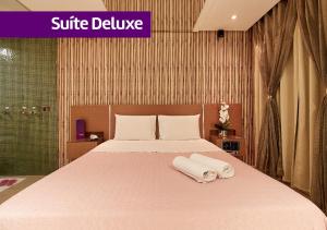 Ένα ή περισσότερα κρεβάτια σε δωμάτιο στο Intense Motel +12 φωτογραφίες