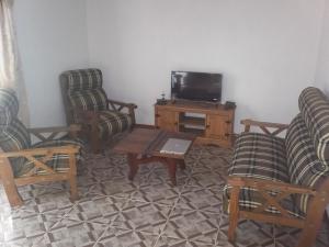 TV a/nebo společenská místnost v ubytování Casa Costa azul