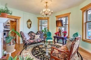 a living room with furniture and a chandelier at Victorian Lake Oasis Hot Tub Private Lakefront in Lake Huntington