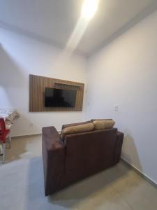 TV a/nebo společenská místnost v ubytování Flat Praia Dourada 5