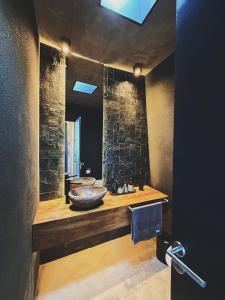 a bathroom with a sink and a mirror at Finca Boutique Un Buen Año in Tres Esquinas +62 photos
