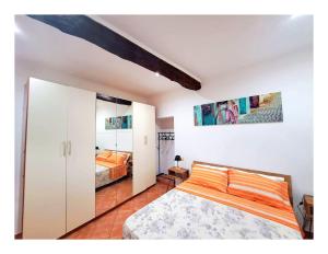 a bedroom with a bed and two beds at La casa del Borgo Anagni in Anagni