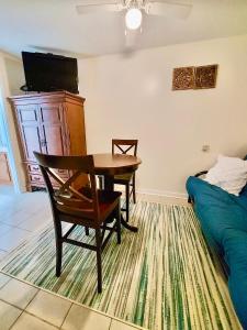 a living room with a table and a bed at Marina Vista Condo III in New Bern