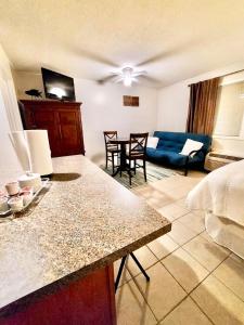a living room with a bed and a table and chairs at Marina Vista Condo III in New Bern